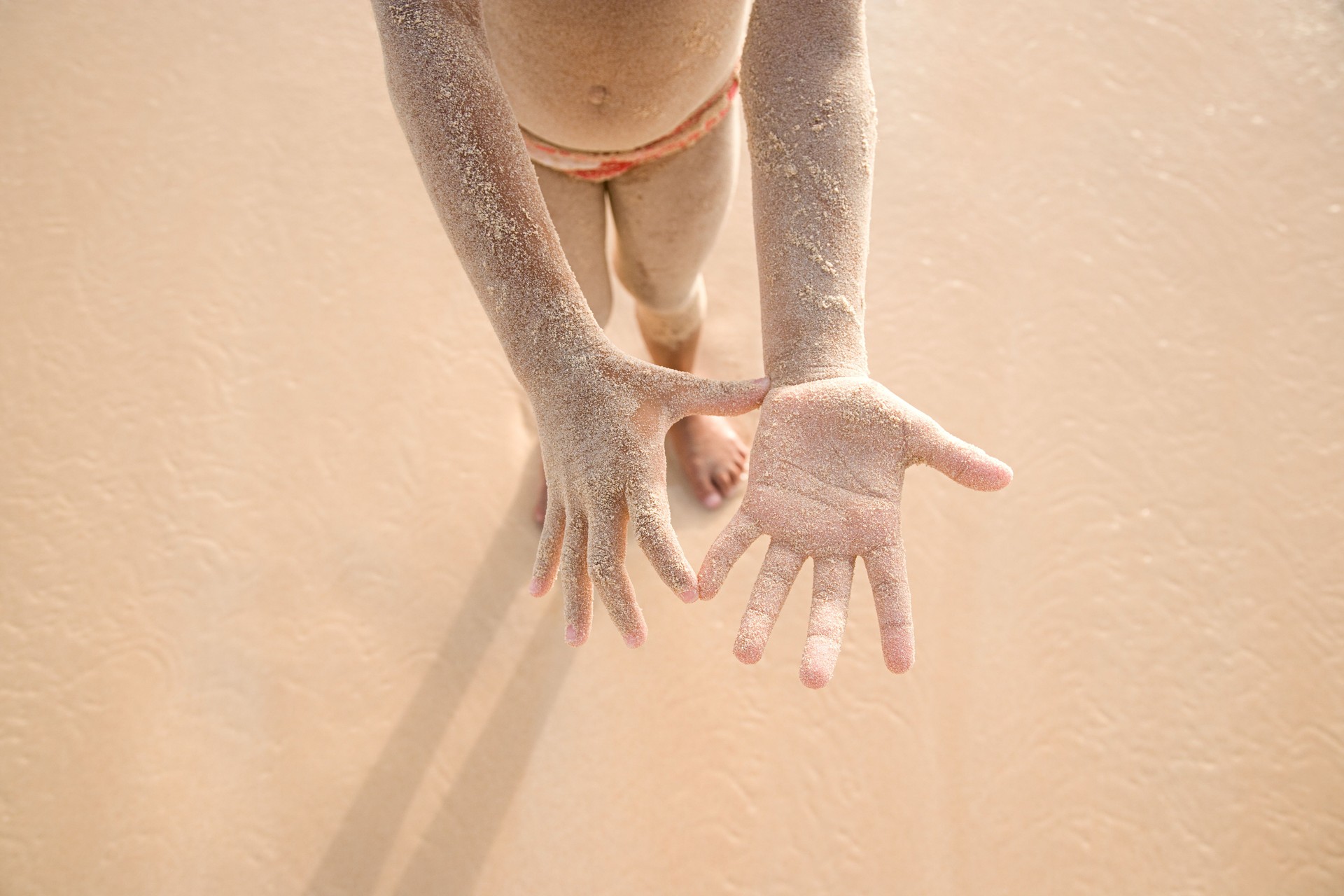 Girl covered in sand
